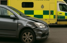 Damaged car and ambulance